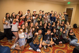 Group of people celebrating on stage
