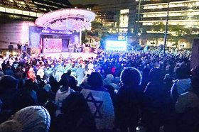 Group of people celebrating on stage