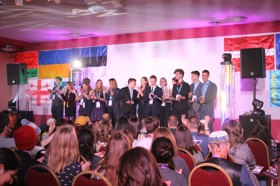 Group of people celebrating on stage