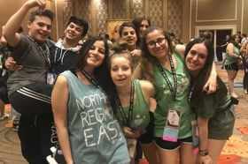 Group of people celebrating on stage