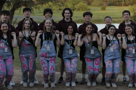 Group of people celebrating on stage