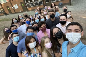 Group of people celebrating on stage