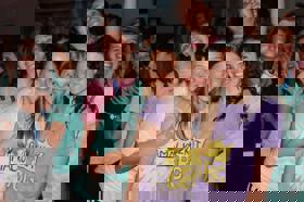 Group of people celebrating on stage