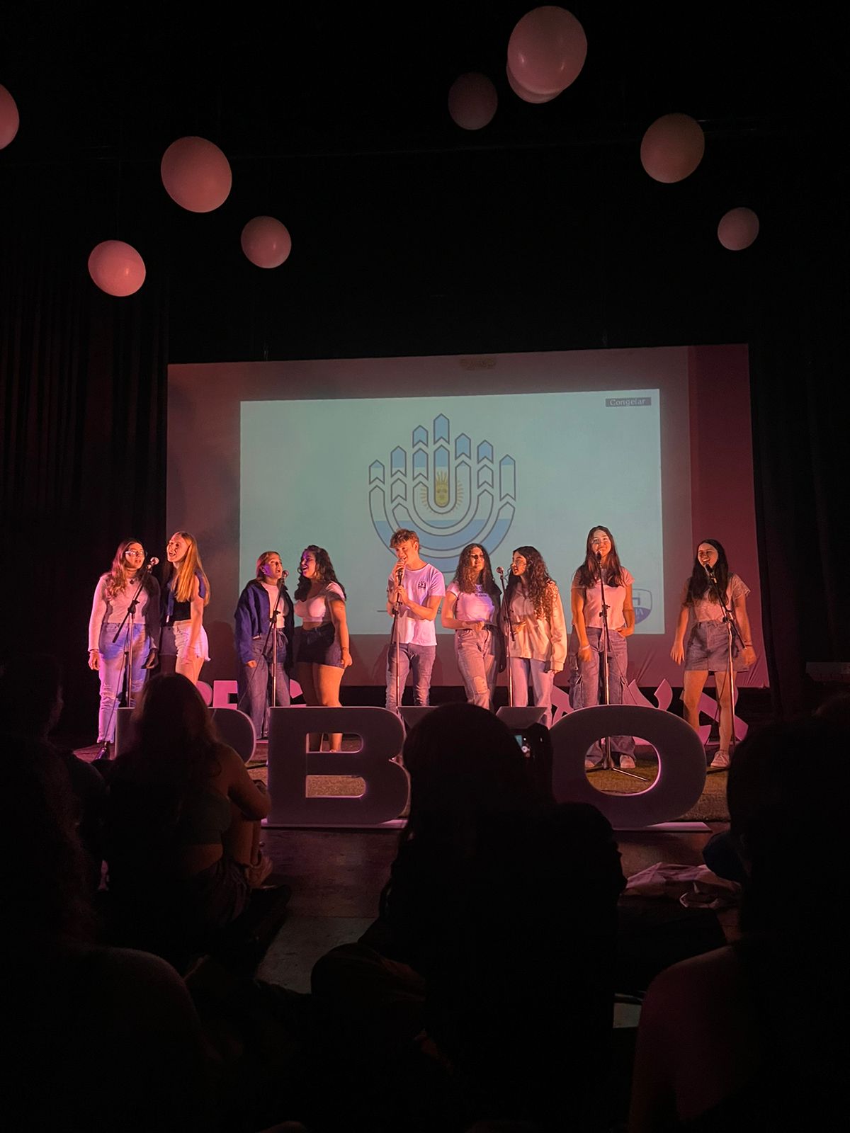 Group of people celebrating on stage