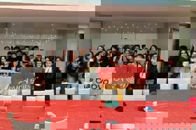 Group of people celebrating on stage