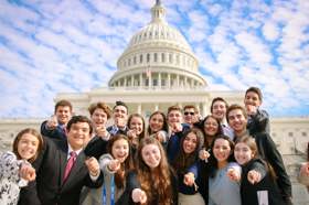 Group of people celebrating on stage