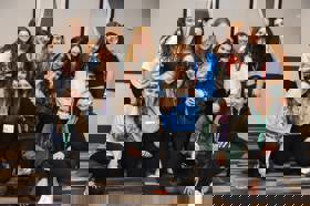 Group of people celebrating on stage