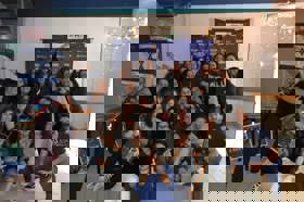 Group of people celebrating on stage