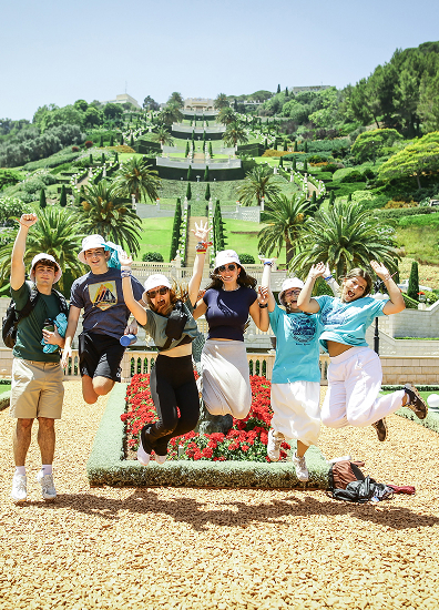 BBYO Centennial celebration with confetti, lights, and a crowd of attendees