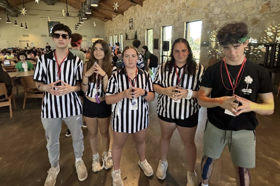 Group of people celebrating on stage