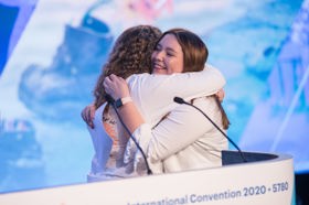 Group of people celebrating on stage