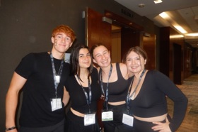 Group of people celebrating on stage