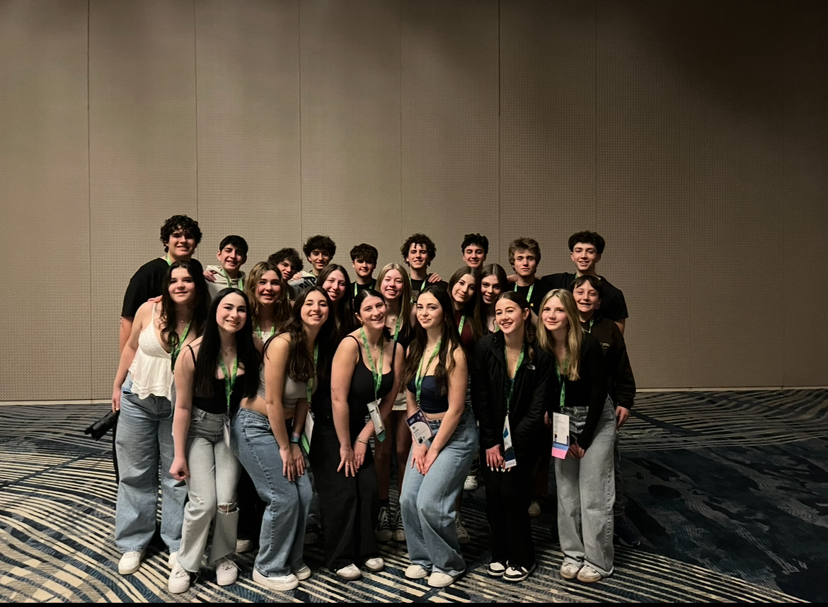 Group of people celebrating on stage