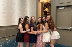 Group of people celebrating on stage