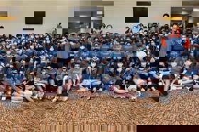 Group of people celebrating on stage