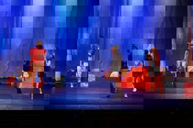 Group of people celebrating on stage