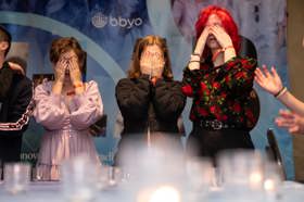 Group of people celebrating on stage