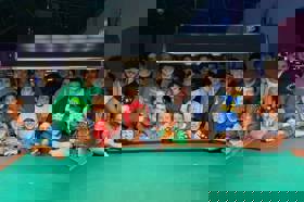 Group of people celebrating on stage