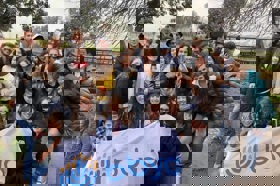 Group of people celebrating on stage