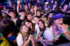 Group of people celebrating on stage