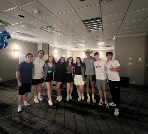 Group of people celebrating on stage