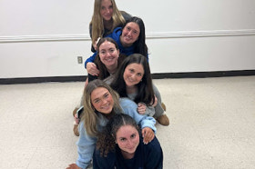 Group of people celebrating on stage