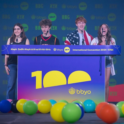 Three friends sitting on a hammock