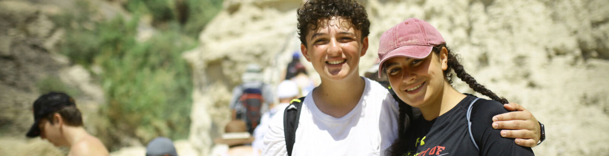 Group of diverse young people smiling at a community event