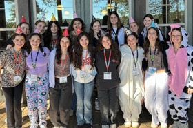 Group of people celebrating on stage