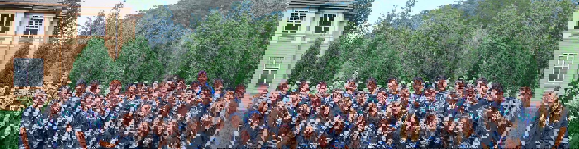 Group of diverse young people smiling at a community event