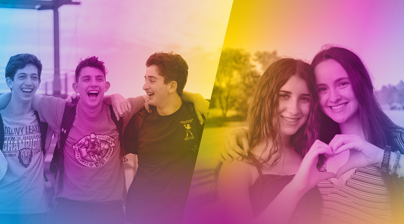 A diverse crowd of people celebrating at a concert, raising their hands and cheering.