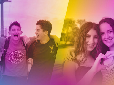 A diverse crowd of people celebrating at a concert, raising their hands and cheering.