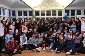 Group of people celebrating on stage