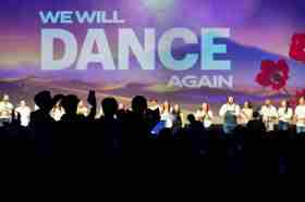 Group of people celebrating on stage