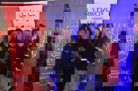 Group of people celebrating on stage