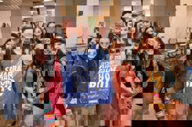 Group of people celebrating on stage